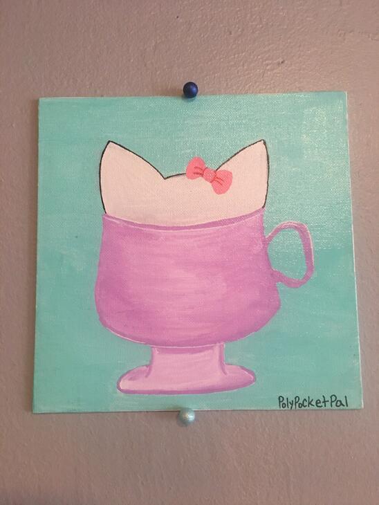 Kitty in pink cup